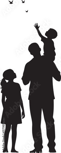 Father and children watching birds fly in the sky together