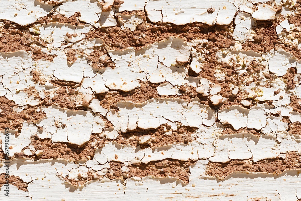 Naklejka premium Cracked paint surface with sandy texture