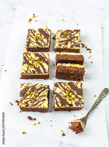 Photography Dubai chocolate style brownie, chocolate cake slices with pistachio and kadayif