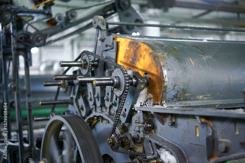 Innovative carding machine mechanism at work in a textile factory, showcasing the intricate engineering and design Innovative carding machine mechanism at work in a textile factory, showcasing the intricate engineering and design