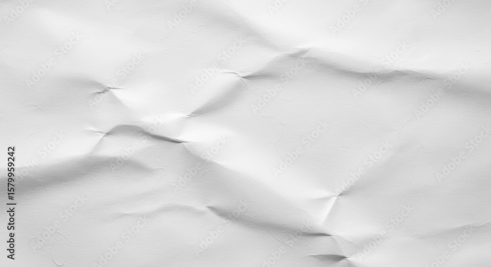 Obraz premium Crumpled white paper texture showing shadows and highlights.premium paper texture photo for poster, banner, and pamphlet background