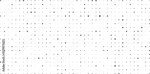 Abstract monochrome pattern of dots and circles arranged in a grid formation with variations in size and tone creating a visual texture.