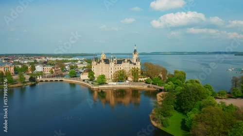 Stunning drone shot of Schwerin Castle with gardens and water in Germany. 