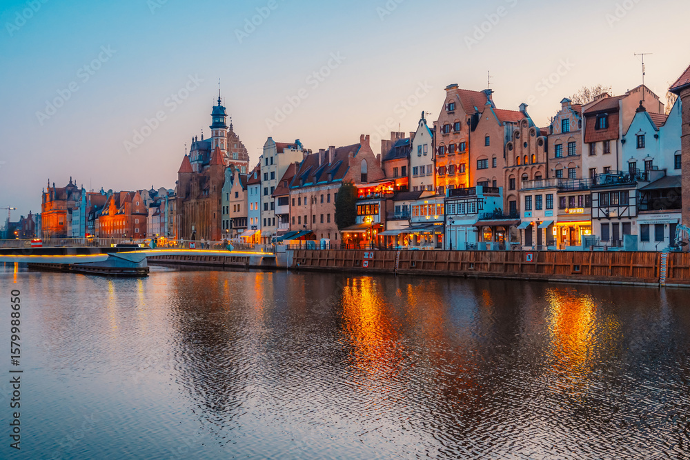 Obraz premium Gdansk with Motlawa river in Poland. Old town colourful house with Zuraw or crane and with Holy Spirit Gate
