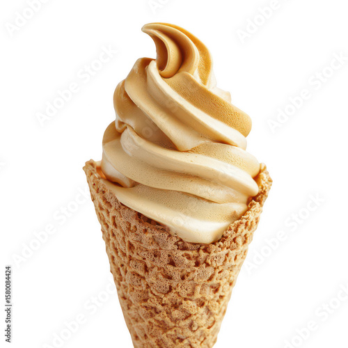 Caramel-colored soft serve ice cream in waffle cone