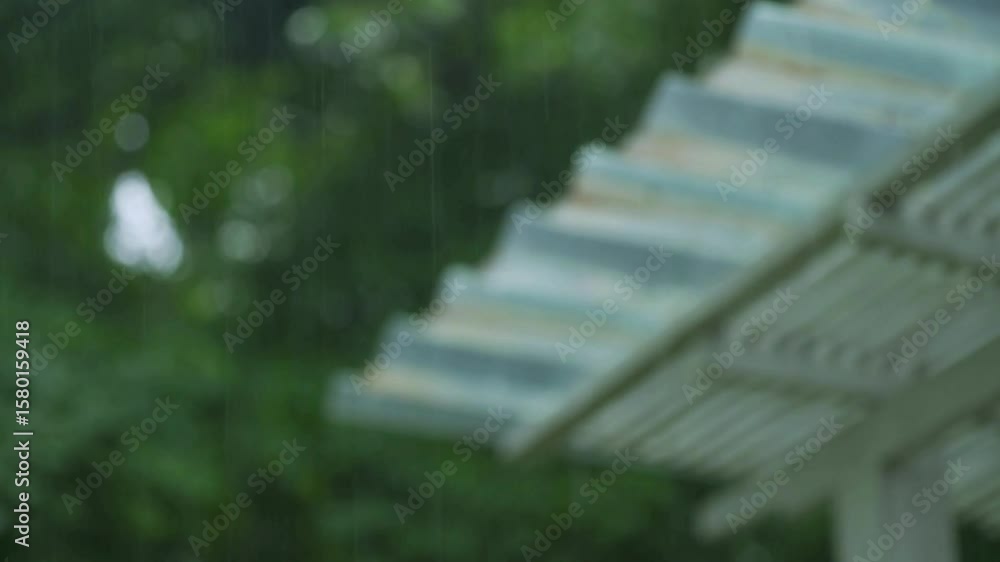 video Heavy rain from the roof of a fiber house in Indonesia, water flows slowly falling, In the rainy season, Slow Motion Macro Video. 4k 60fps video Heavy rain from the roof of a fiber house in Indonesia, water flows slowly falling, In the rainy season, Slow Motion Macro Video. 4k 60fps