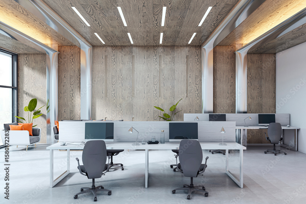Fototapeta premium Modern empty office interior with sleek desks, computer setups, wooden wall panels, and natural daylight in contemporary corporate workspace. 3D Rendering