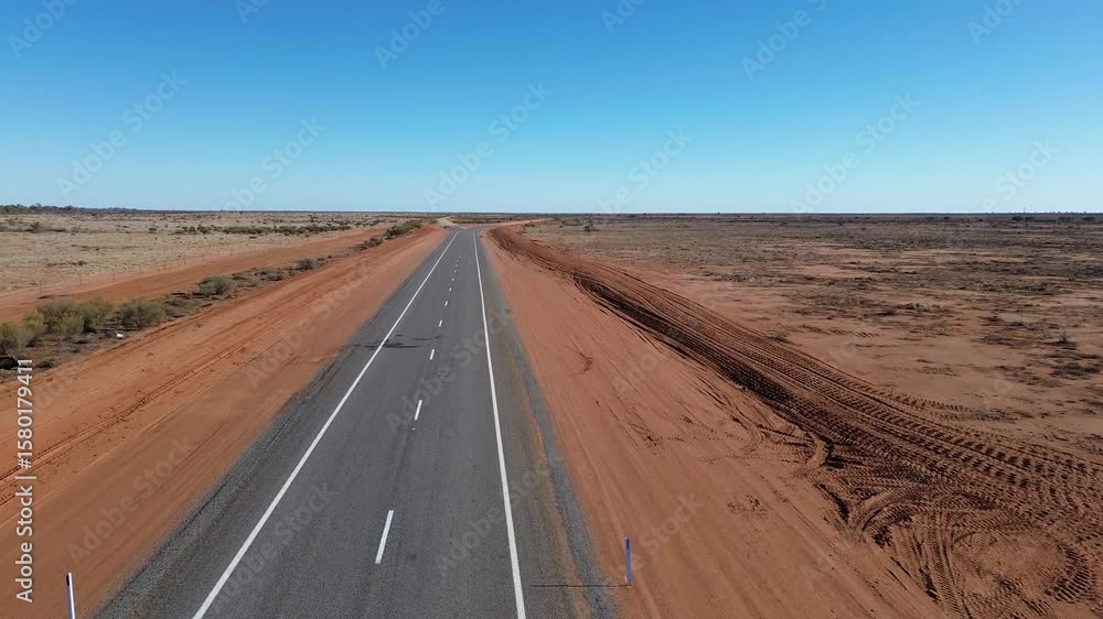 Endless Bitumen Through the Outback
A drone’s-eye view of a lone sealed road cutting through Australia’s vast, rugged outback—endless skies, red earth, and total isolation. Endless Bitumen Through the Outback
A drone’s-eye view of a lone sealed road cutting through Australia’s vast, rugged outback—endless skies, red earth, and total isolation.