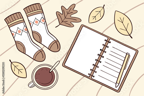 Cozy autumn scene with a pair of patterned socks a steaming cup of coffee an open notebook with a pen and fallen leaves on a textured background