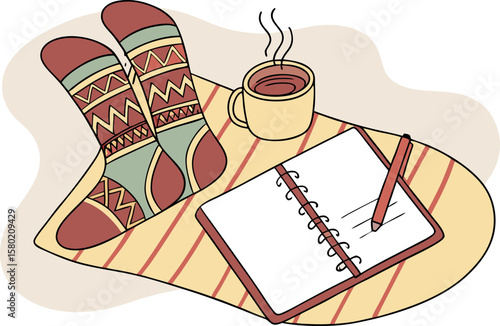 Cozy scene of feet wearing patterned socks resting on a blanket with a warm cup of coffee and an open notebook and pencil for journaling