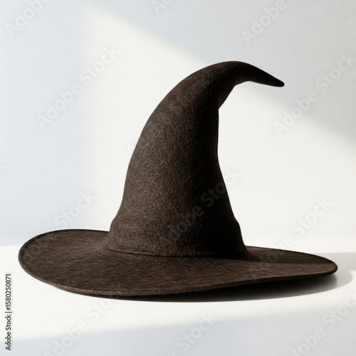 Witch's hat on a white shelf in the sunlight. Halloween Concept.