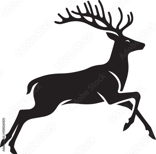 Black silhouette of a powerful stag jumping with long antlers in the wild