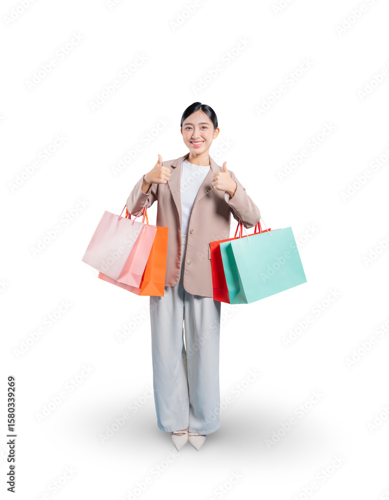 A very happy young Asian woman holding shopping bags gives two thumbs up to the camera, expressing her complete satisfaction and enthusiastic approval of her shopping experience. A very happy young Asian woman holding shopping bags gives two thumbs up to the camera, expressing her complete satisfaction and enthusiastic approval of her shopping experience.