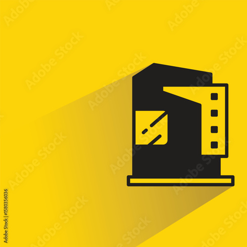 apartment building icon with shadow on yellow background