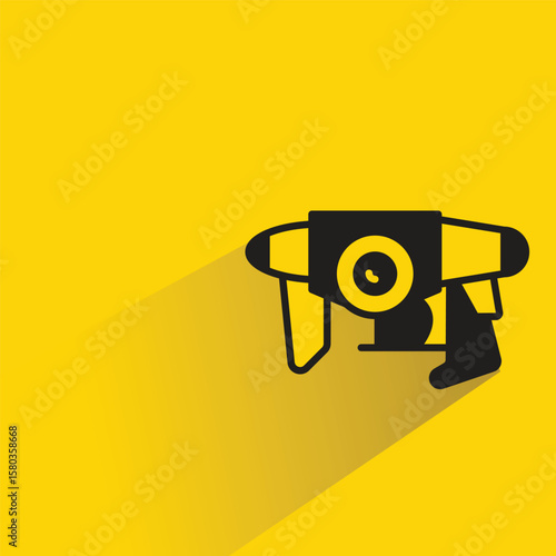 space gun with shadow on yellow background