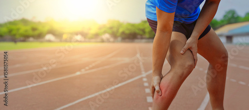 Tableau sur toile Athlete holding painful red sore calf on running track showing muscle cramp or l