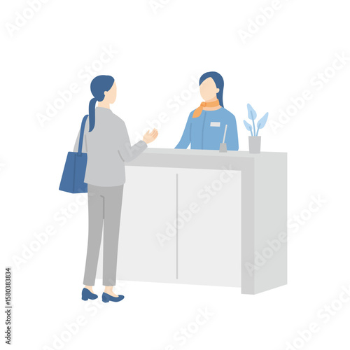 受付で女性客を案内する女性スタッフ