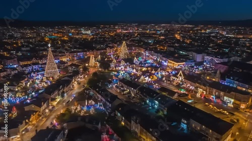 Wallpaper Mural Aerial view of a festive town illuminated with colorful Christmas lights during nighttime Torontodigital.ca