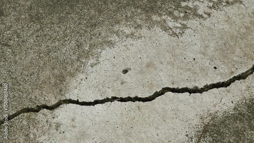 Old concrete wall texture large crack and dirty wall surface with large damage.