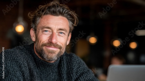Portrait of a Smiling Man with Beard in a Casual Sweater