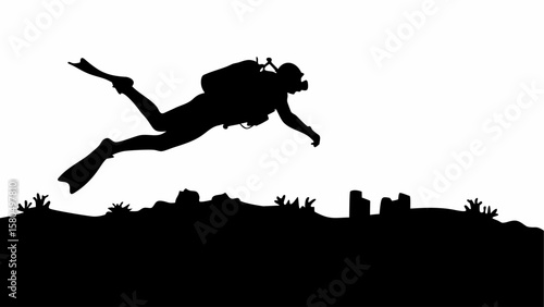 Silhouette of a scuba diver swimming over a coral reef with underwater structures in the distance
