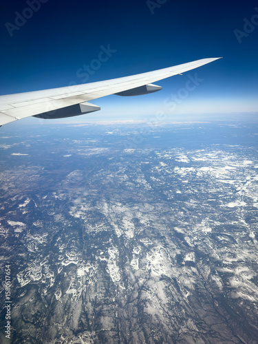 View from a plane passing over the frozen landscape of northern Canada and the Labrador Sea.