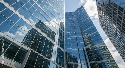 Modern Glass Office Buildings Reflecting Blue Sky