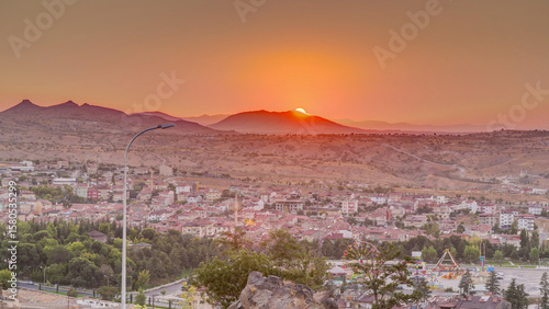 Sunset view from old castle in historical city town of Nevsehir aerial timelapse