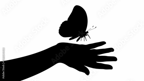 Silhouette of a butterfly perched delicately on an outstretched hand against a white background image view