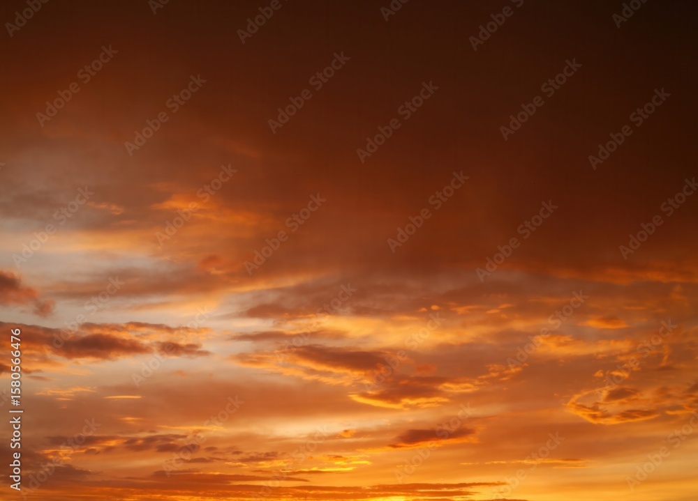 Fototapeta premium The sky is orange and cloudy. Vertical background, wallpapers.