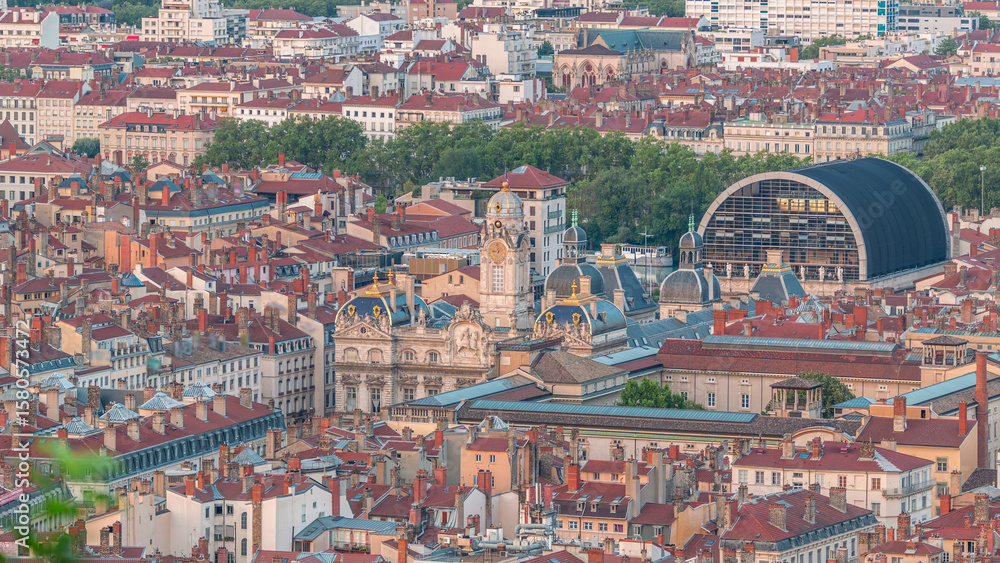 Fototapeta premium Aerial timelapse of Hotel de Ville de Lyon, the historic city hall of Lyon, France. Historic center with red roofs from above.