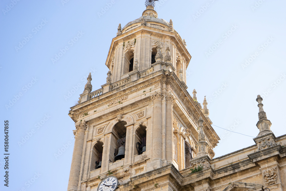 Historic cathedral tower in Jaen, Andalucia showcasing intricate architecture and cultural heritage Historic cathedral tower in Jaen, Andalucia showcasing intricate architecture and cultural heritage