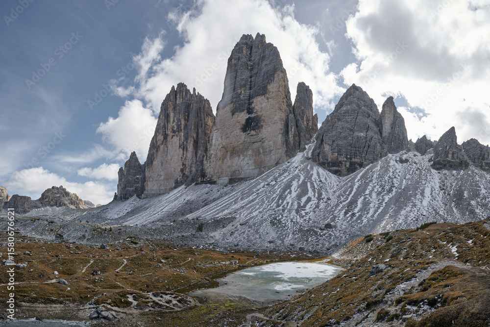 Obraz premium tre cimes in the dolomites with blue sky and clouds