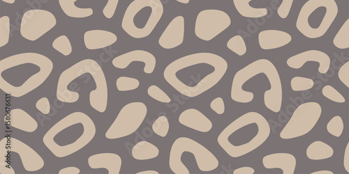 Modern leopard print. Vector seamless pattern with spots, organic shapes. Cut-out style animal skin texture, jaguar, cheetah, leo fur. Abstract brown and beige background. Repeating all-over design