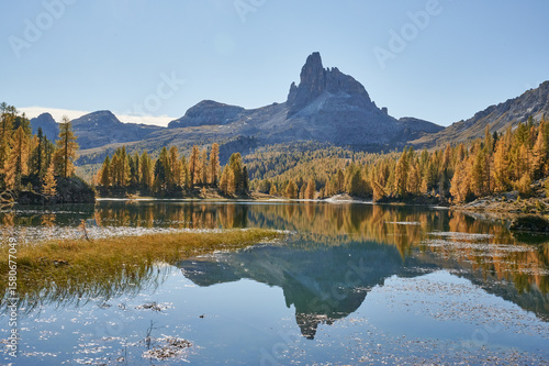 Canvas-taulu autumn in the mountains with a lake and a mountain in the background in the dolo