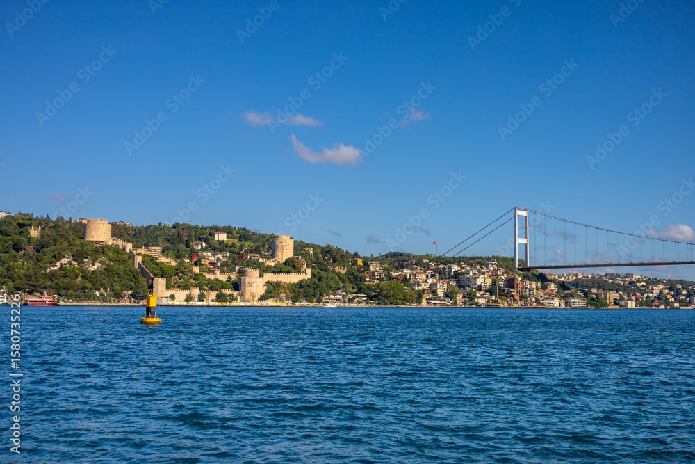 Fototapeta premium Rumeli Fortress and Bosphorus Bridge over Blue Waters – Istanbul View