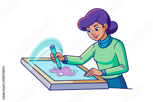 Creative artist focused on drawing a design on a tablet with pens and paper nearby