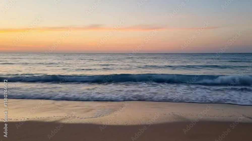 Beach at sunset waves washing ashore sand reflecting light sky gradient from orange to blue Beach at sunset waves washing ashore sand reflecting light sky gradient from orange to blue