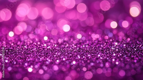 Close-up view of a vibrant purple glitter background.