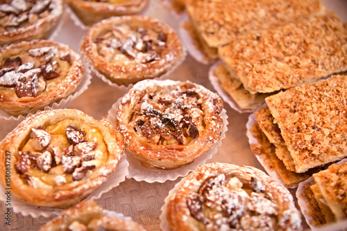 Traditional portuguese cakes pasteis de nata. Freshly baked crunchy traditional Portuguese dessert. Pastle de Nata with custard on the counter. Pasteis de nata