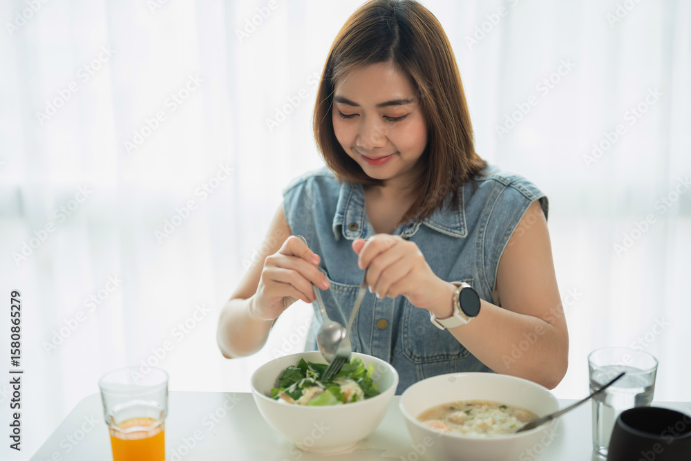 Young Woman Enjoys Healthy Meal with Salad and Soup in Bright Modern Kitchen, Natural Light, Relaxed Dining Atmosphere, Wellness Concept Young Woman Enjoys Healthy Meal with Salad and Soup in Bright Modern Kitchen, Natural Light, Relaxed Dining Atmosphere, Wellness Concept