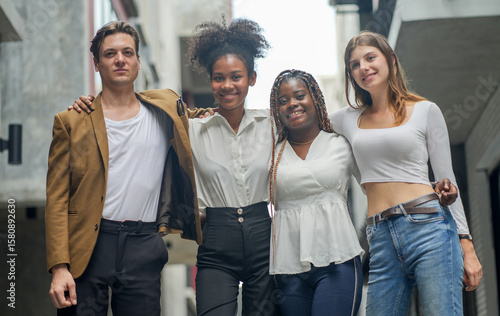Confident diverse people posing together outdoors