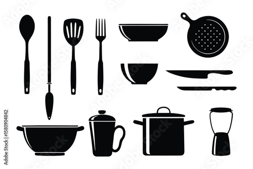 Kitchen Utensils: A collection of kitchen tools displayed in monochrome, capturing essential items for culinary endeavors, highlighting functionality and timelessness.