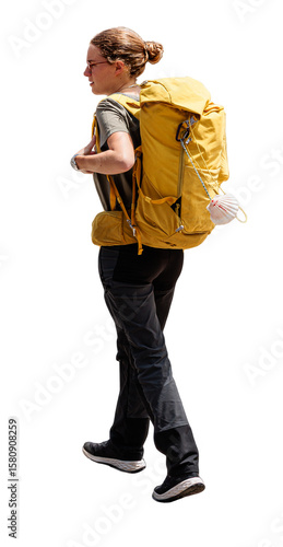 isolated Pilgrim carrying a yellow backpack walking Camino de Santiago, side view