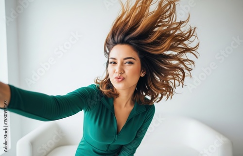 Wallpaper Mural Young cheerful woman in form-fitting clothes takes fun selfie with phone in cozy living room setting

 Torontodigital.ca