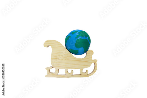 Miniature Earth globe on wooden Christmas sleigh isolated on transparent background, symbolizing global holiday celebration and environmental awareness. Sustainable christmas. Eco-friendly christmas. 