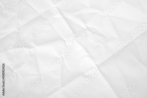 White folded and wrinkled paper texture background
