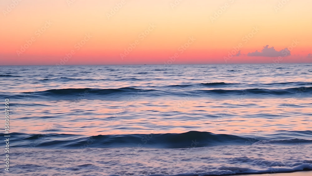 Obraz premium Ocean Calm – Gentle waves and a pink sunset