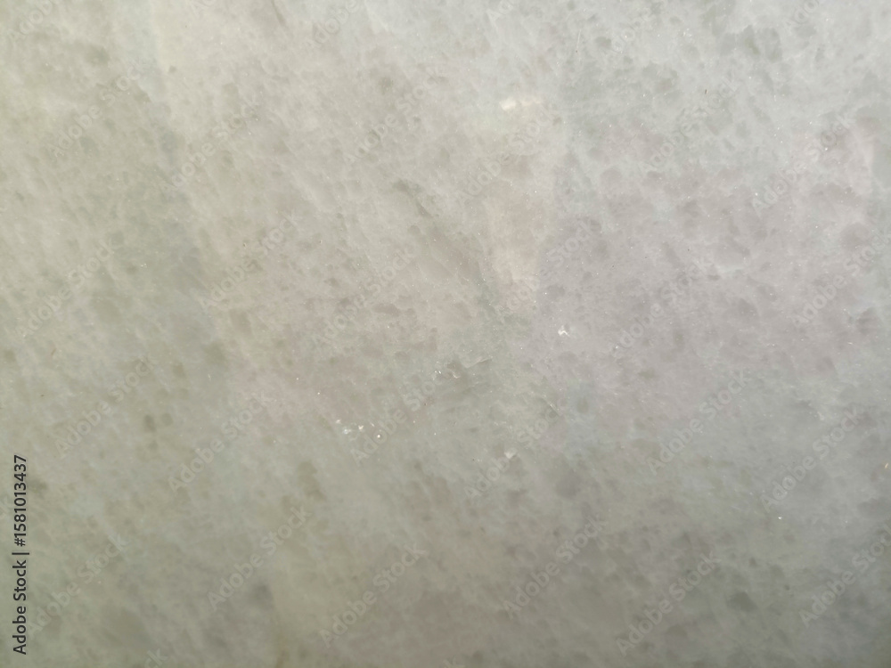 Fototapeta premium Bright plain cream marble texture with subtle veins.