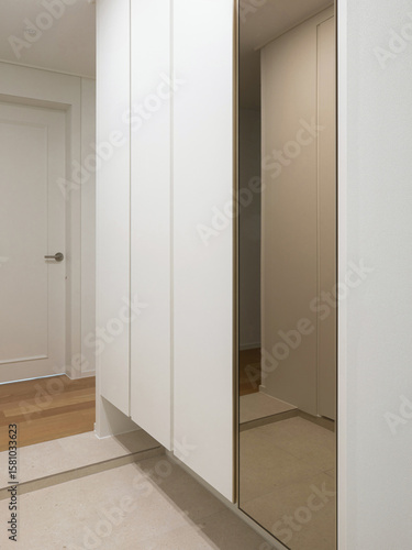 We installed a full-length mirror in the shoe cabinet right next to the entrance to increase its usability